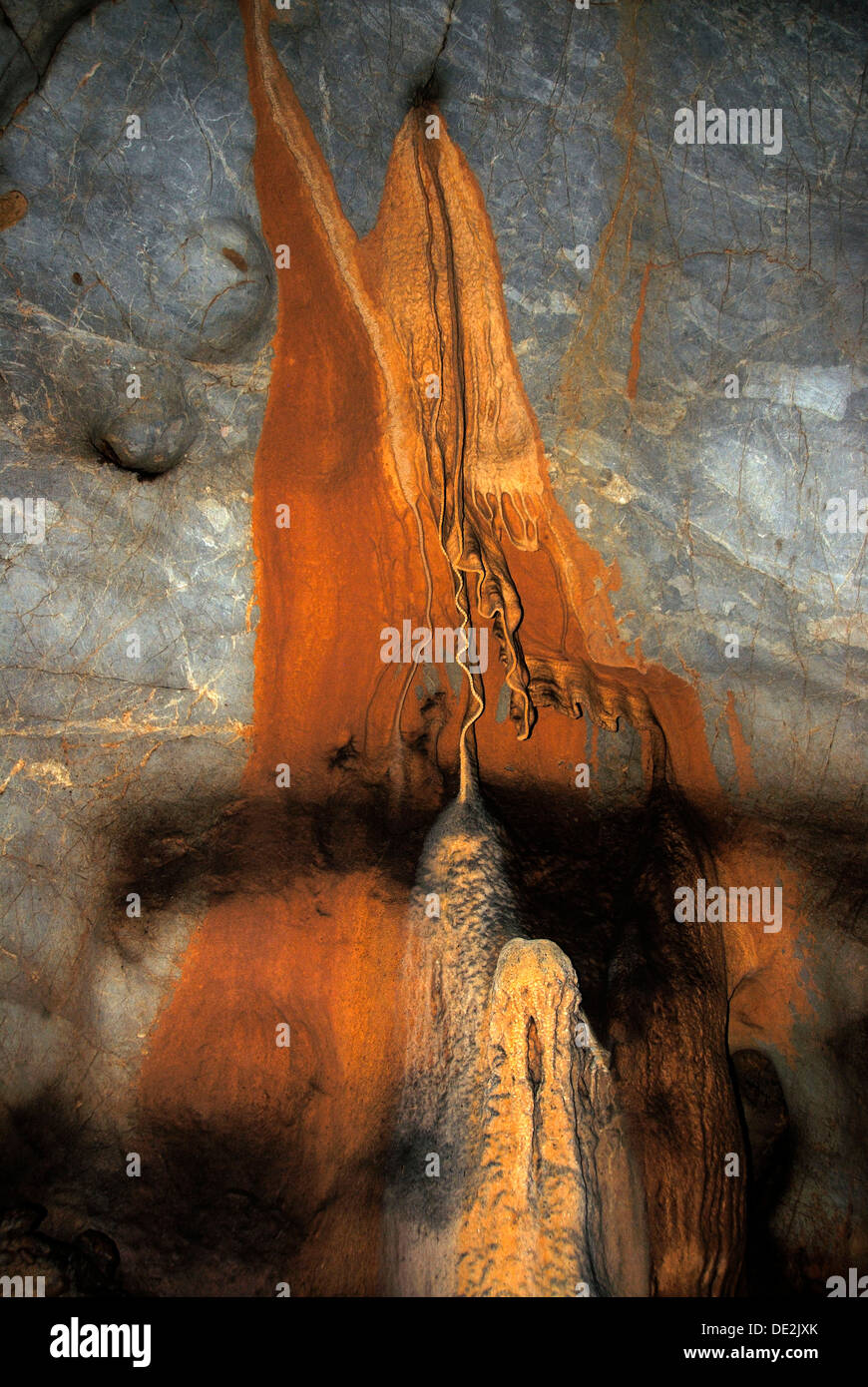 Calcification, stalactite, speleothem, sinter, calcareous sinter, orange, rust, mineral deposits, cave Stock Photo