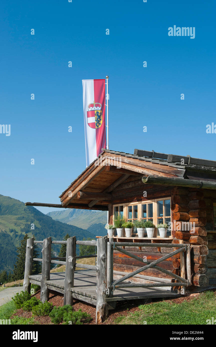 Rustic Wieser alpine hut with flag, Hasenauer Kamm, ridge, Reiterkogel, Saalbach-Hinterglemm district, Pinzgau region Stock Photo