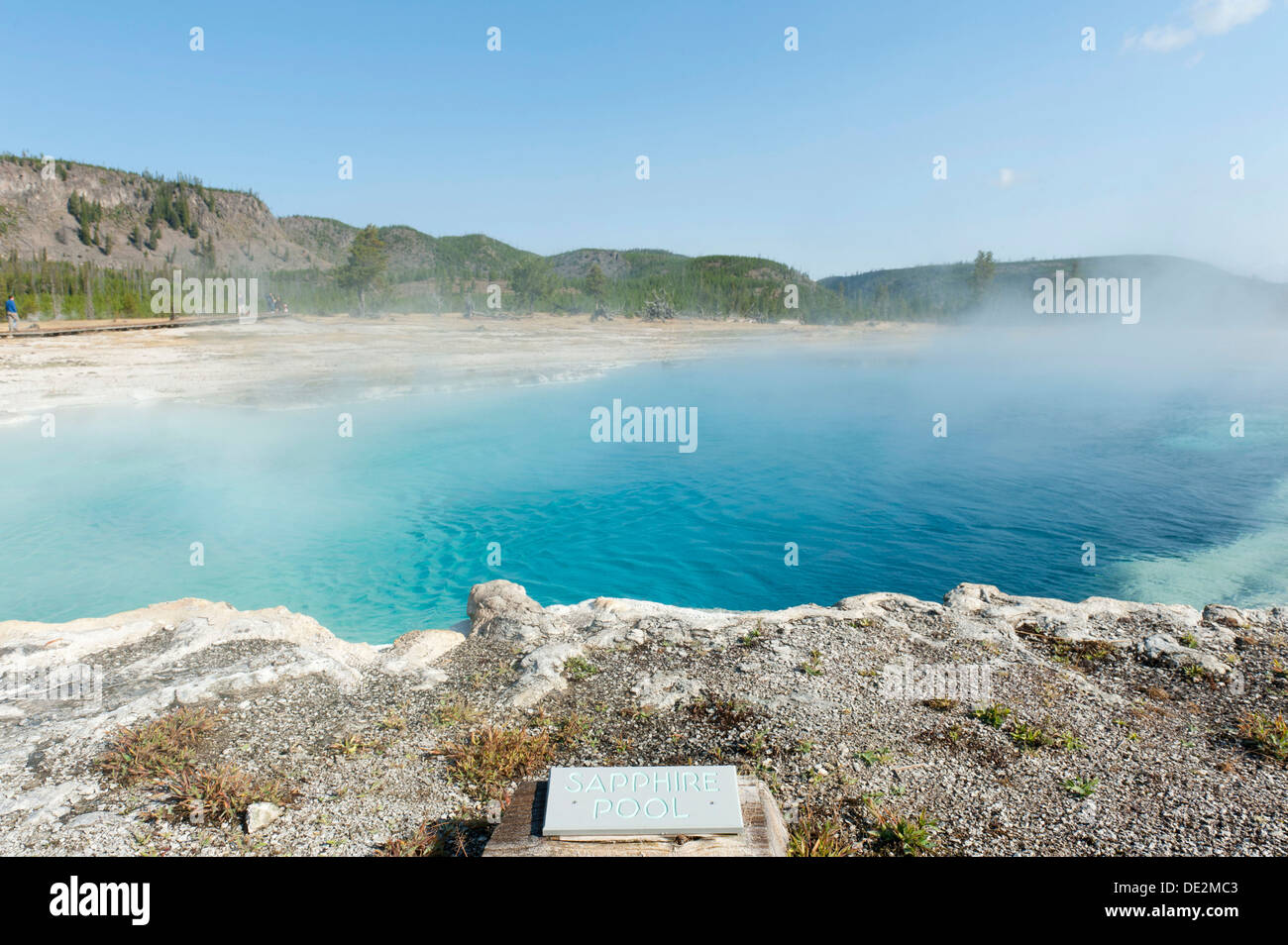 Hot spring, blue water, water vapor, Sappire Pool with a sign, Biscuit Basin, Yellowstone National Park, Wyoming Stock Photo