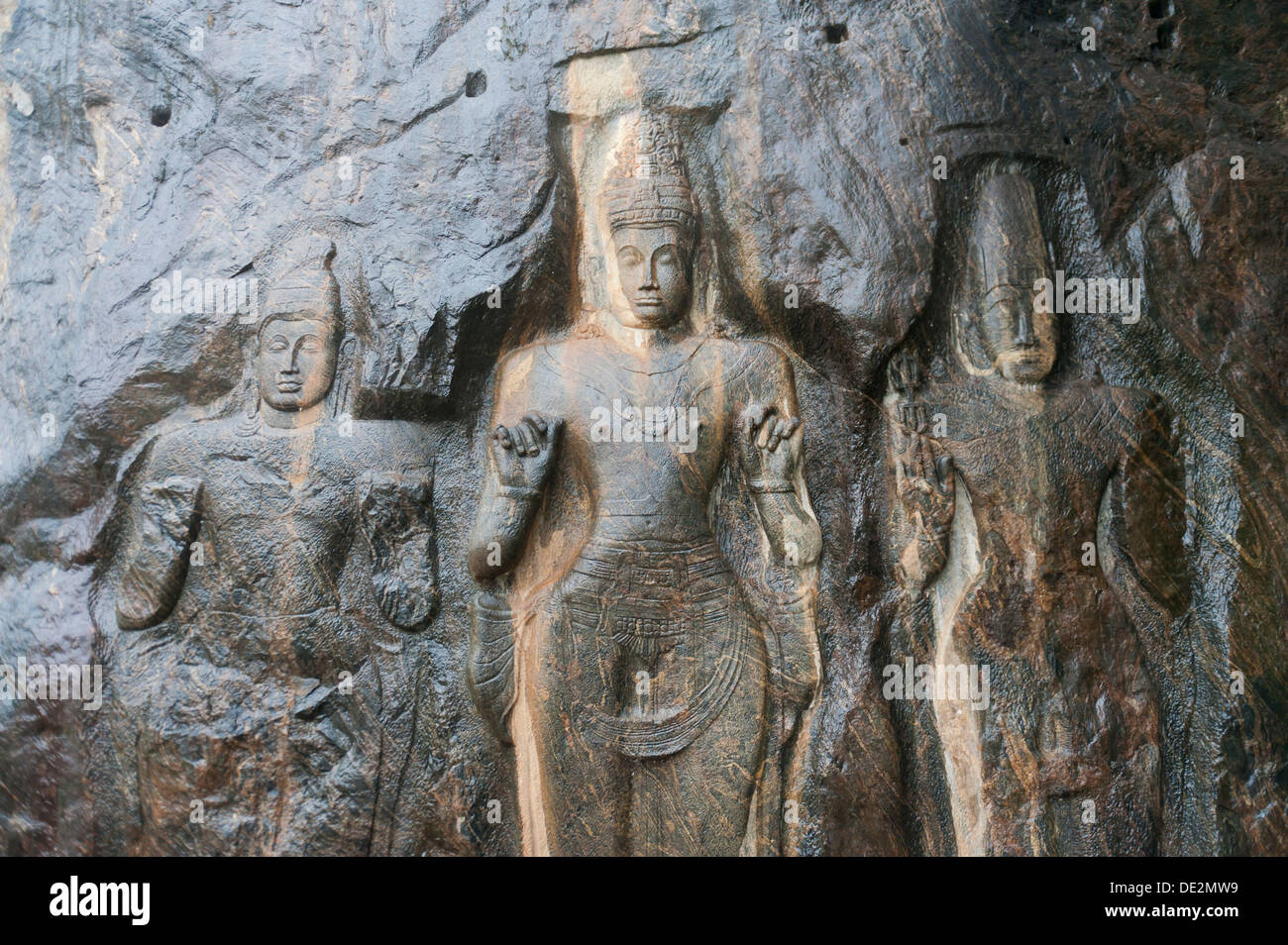 Shrine of Mahayana Buddhism, three old Buddha statues as rock reliefs, Buduruvagala, Wellawaya, Monaragala Distrikt, Sri Lanka Stock Photo