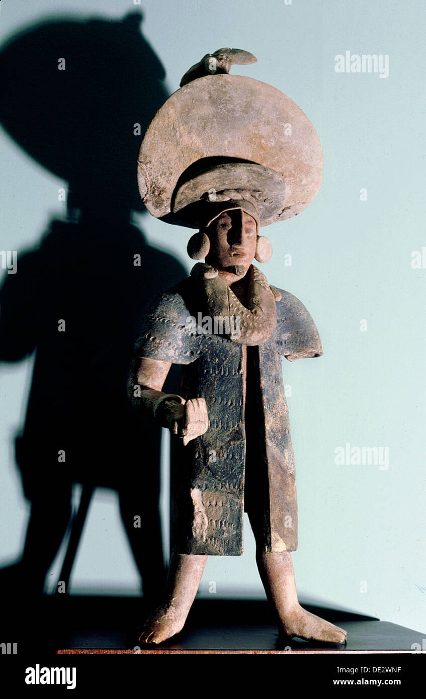Figurine of a man wearing a large hat 