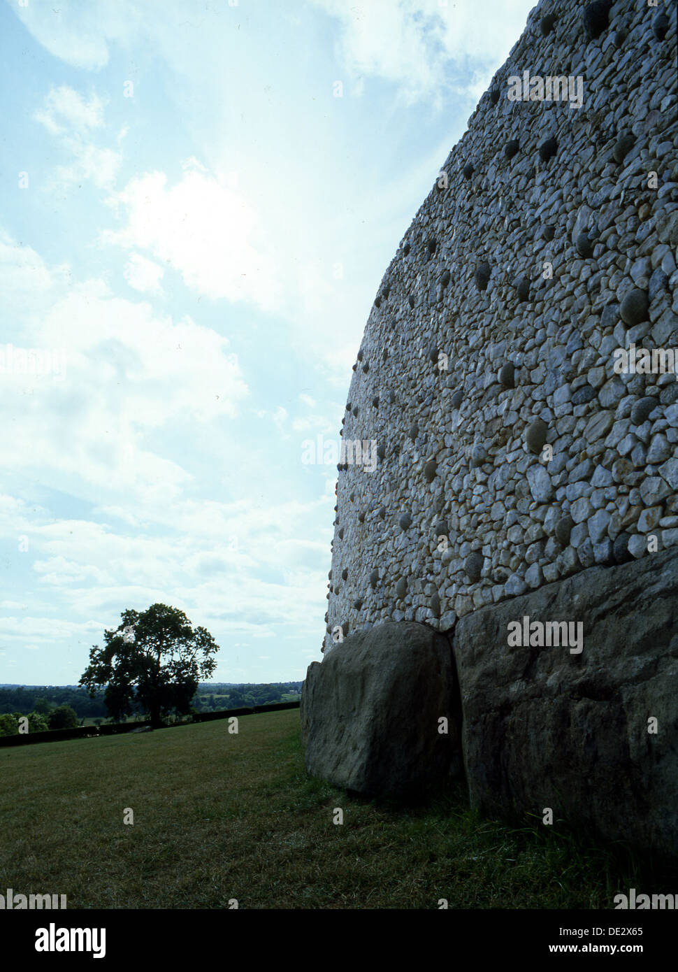 View of the stone walls that surround the heart-shaper mound covering the prehistoric passage tomb at Newgrange. Stock Photo