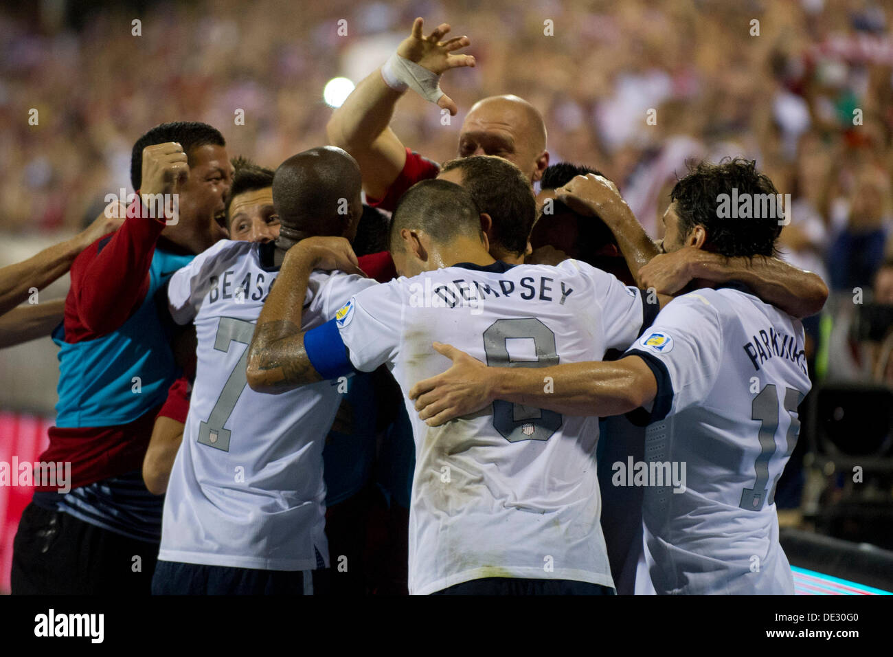 Columbus, Ohio, USA. 10th Sep, 2013. September 10, 2013: US Men's National Team forward Landon Donovan (10) is mobbed by US Men's National Team forward Clint Dempsey (8), US Men's National Team defender DaMarcus Beasley (7) and the rest of the team after scoring the second goal of the match during the U.S. Men's National Team vs. Mexico National Team- World Cup Qualifier match at Columbus Crew Stadium - Columbus, OH. The United States Men's National Team defeated The Mexico National Team 2-0 and clinched a spot for the World Cup in Brazil. Credit:  csm/Alamy Live News Stock Photo
