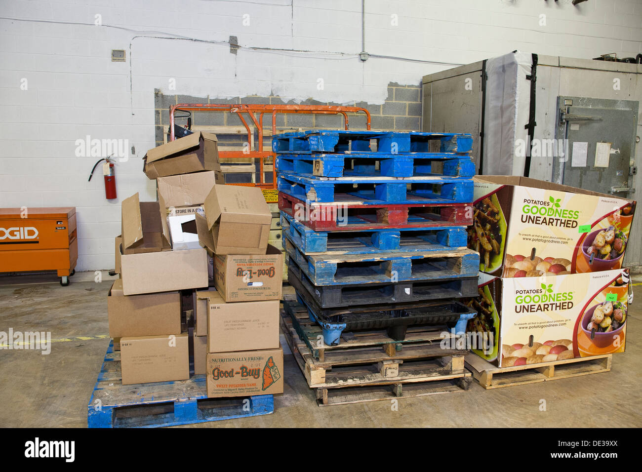 Pallets stacked in warehouse Stock Photo Alamy