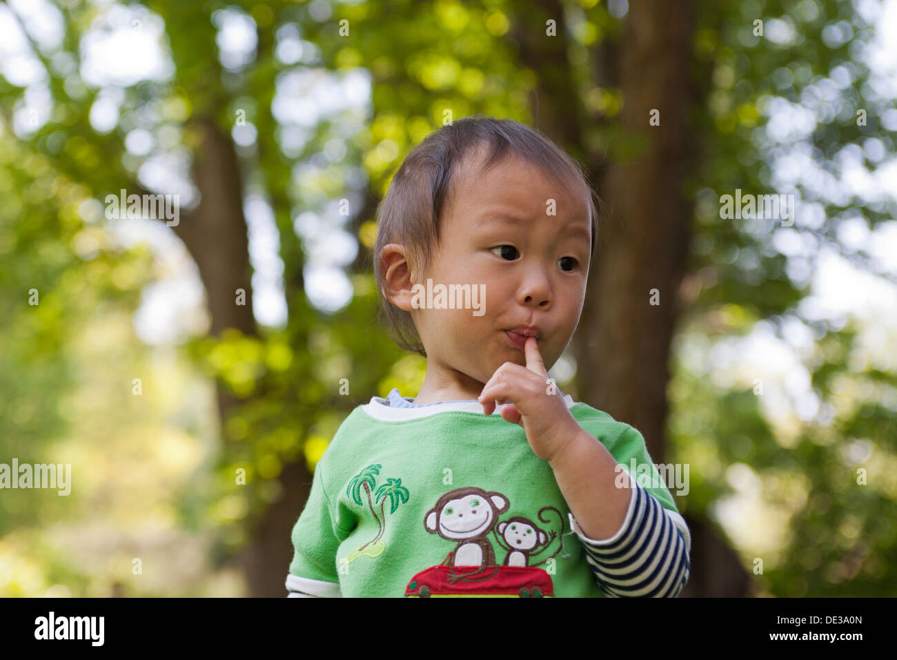Asian baby boy sucking finger Stock Photo