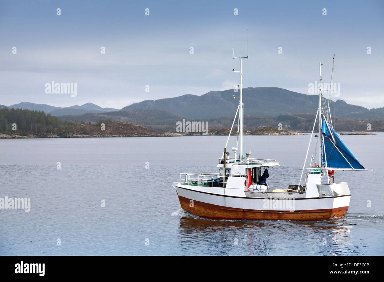 Small fishing boat in fjord of Norway Stock Photo