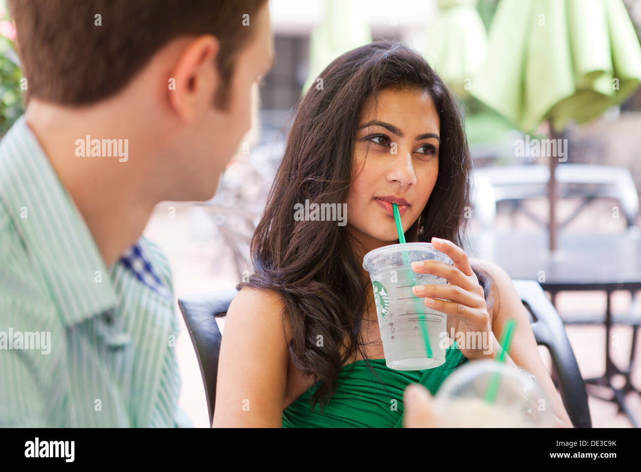 Young woman ignoring man's leer Stock Photo