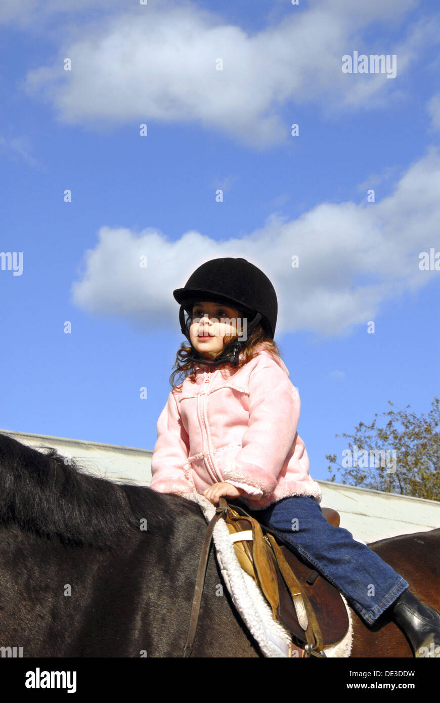 Three year old girl riding a horse, Stanhope Stables, Huntington, NY