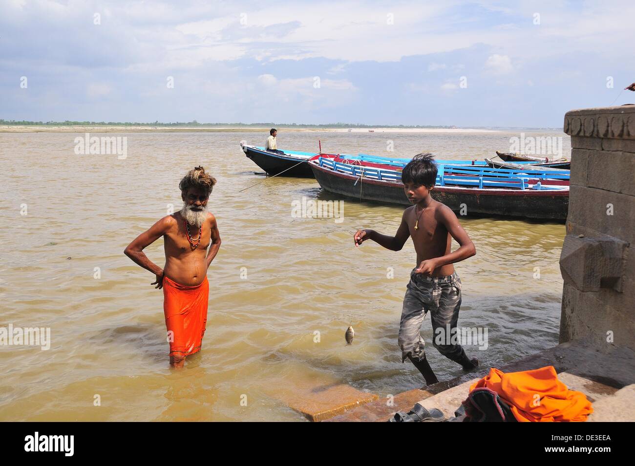 Sadhu bathing at the ghat by the Ganges river Stock Photo - Alamy