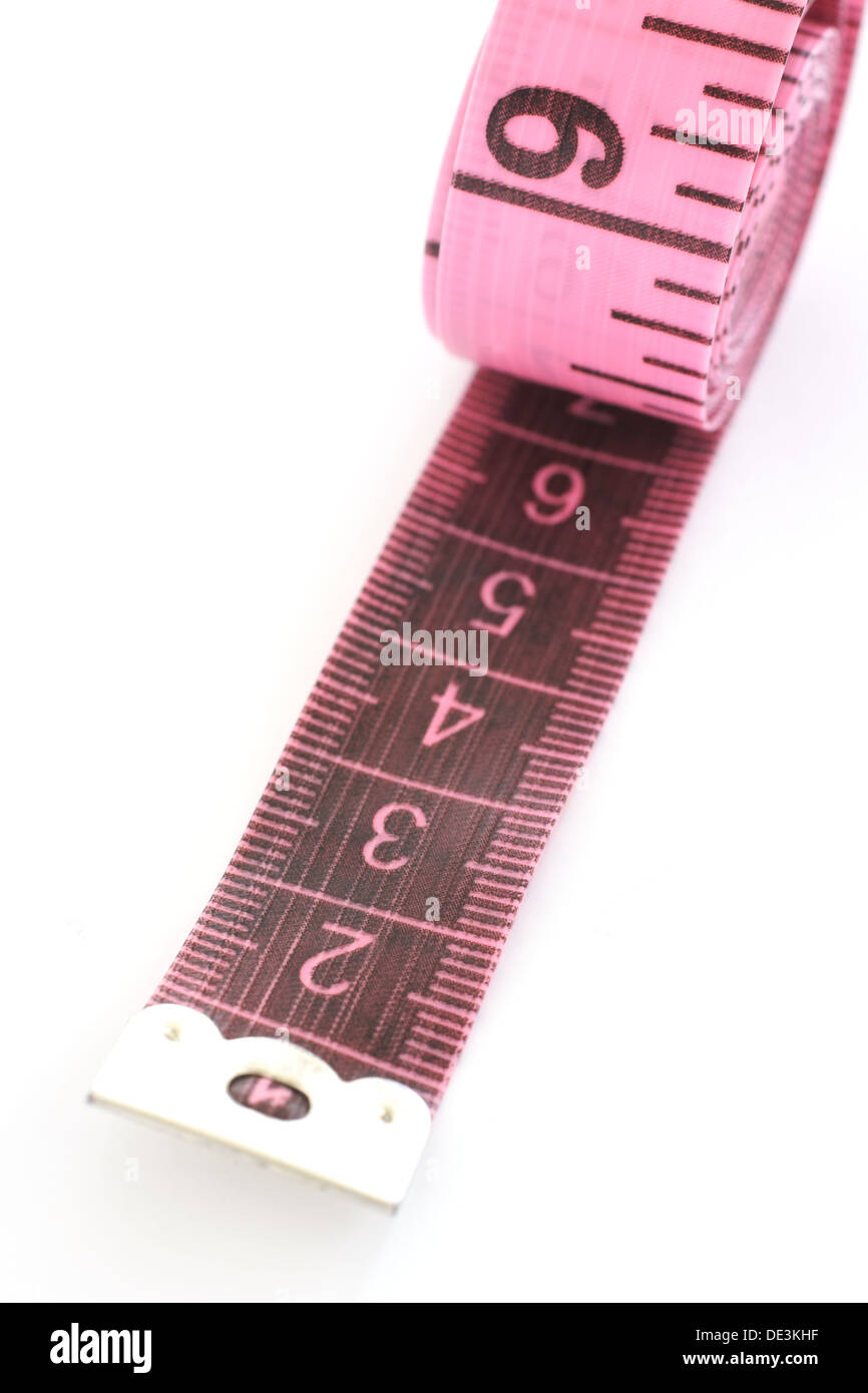 Pink tape measure on an isolated white background Stock Photo - Alamy