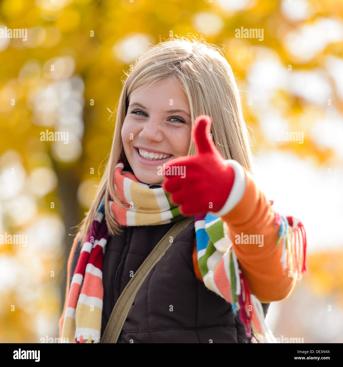 Smiling blonde teenager girl thumbs hi-res stock photography and images ...