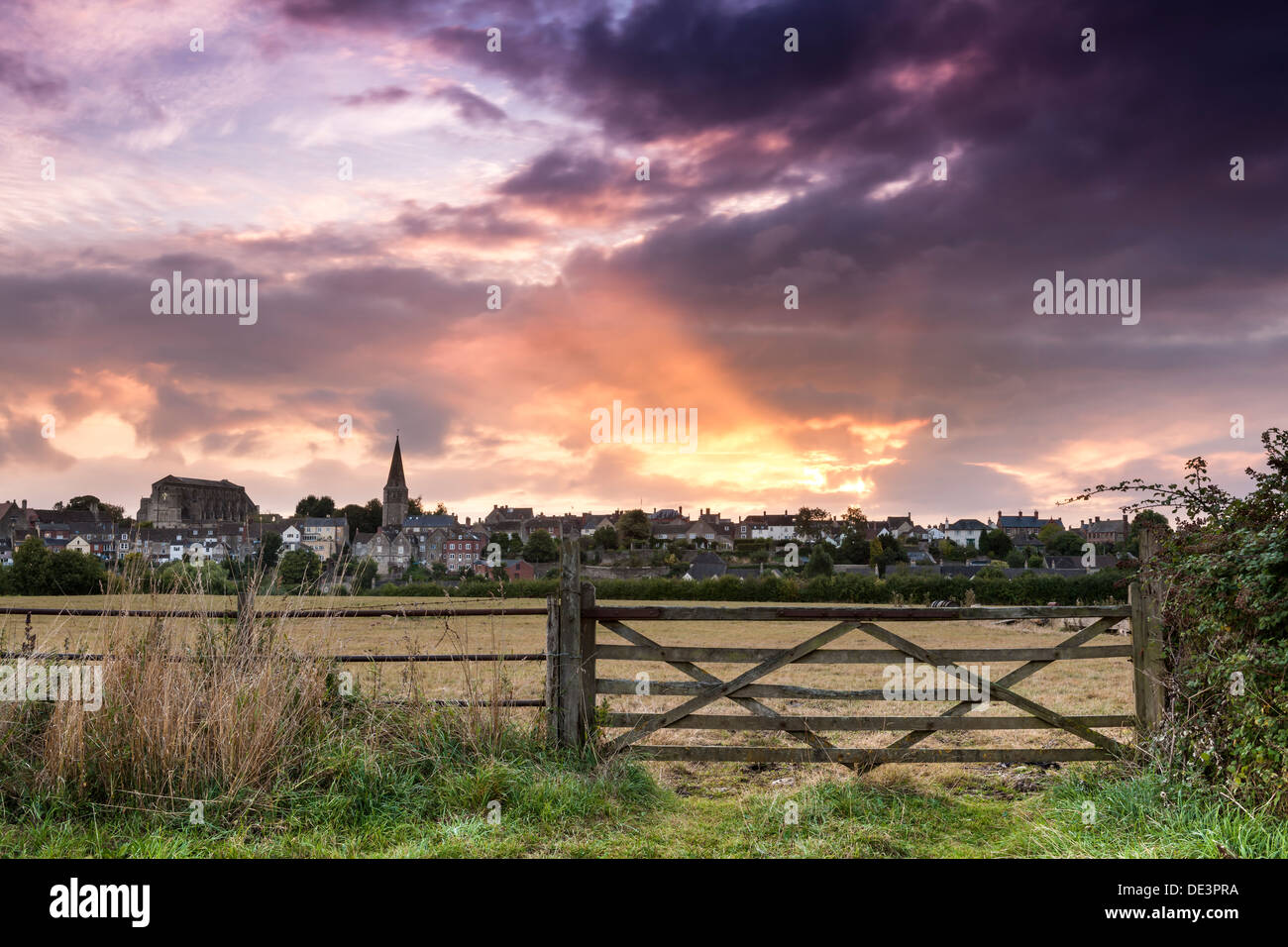 A spectacular sunrise over the Wiltshire hillside town of Malmesbury in September. Stock Photo