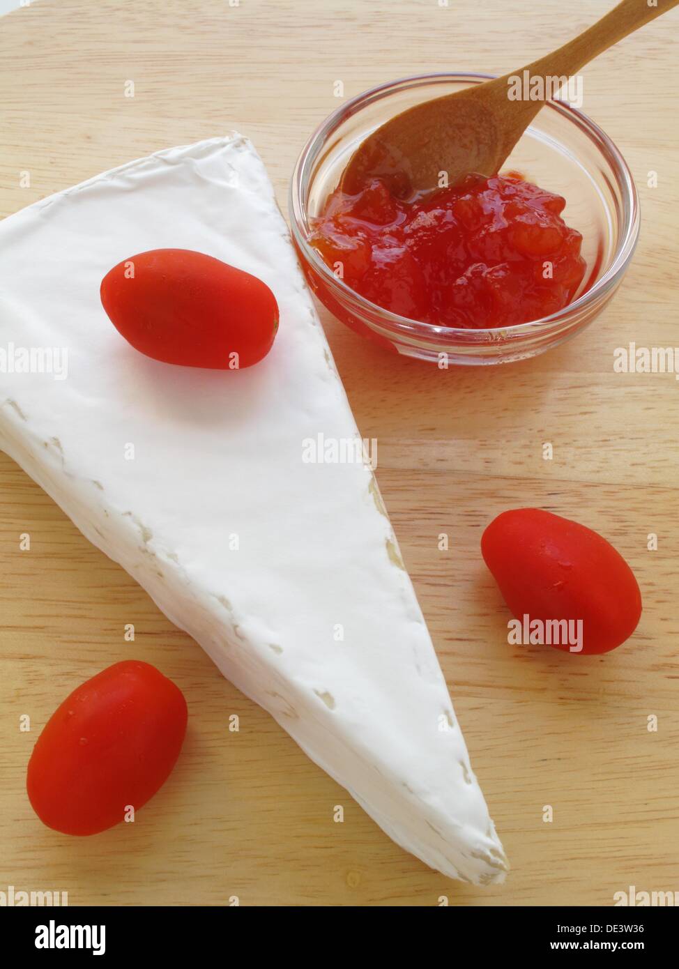 Brie cheese with tomato marmalade Stock Photo Alamy