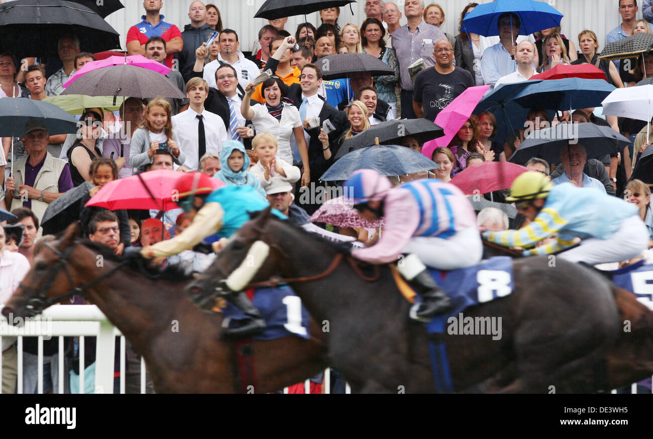 Iffezheim, Germany, people follow a horse race in the rain Stock Photo