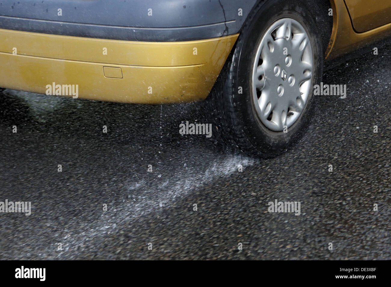 Ascot, United Kingdom, car tires when driving on wet asphalt Stock Photo