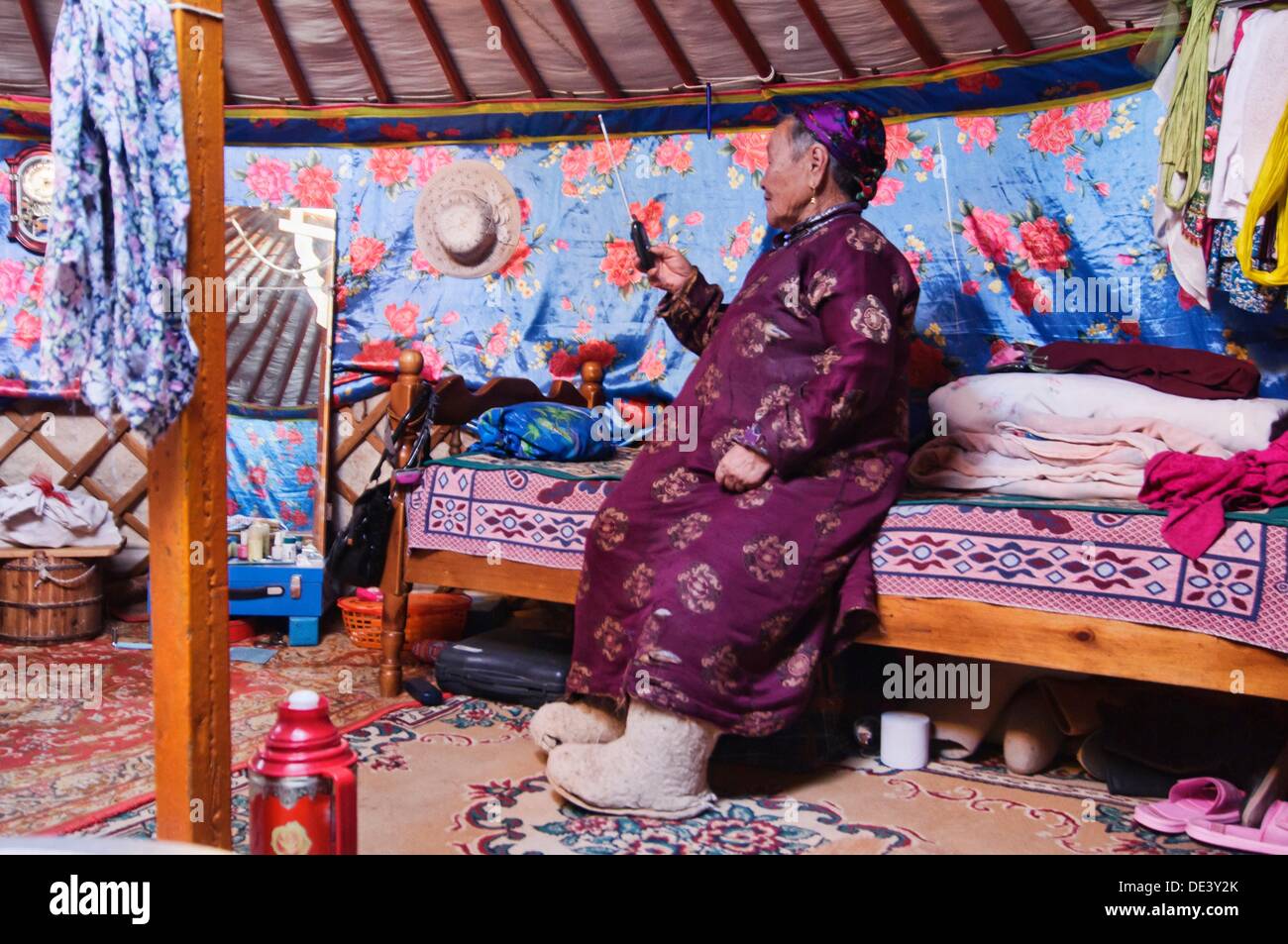 traditional nomad on the phone in her ger in the Gobi Desert of ...