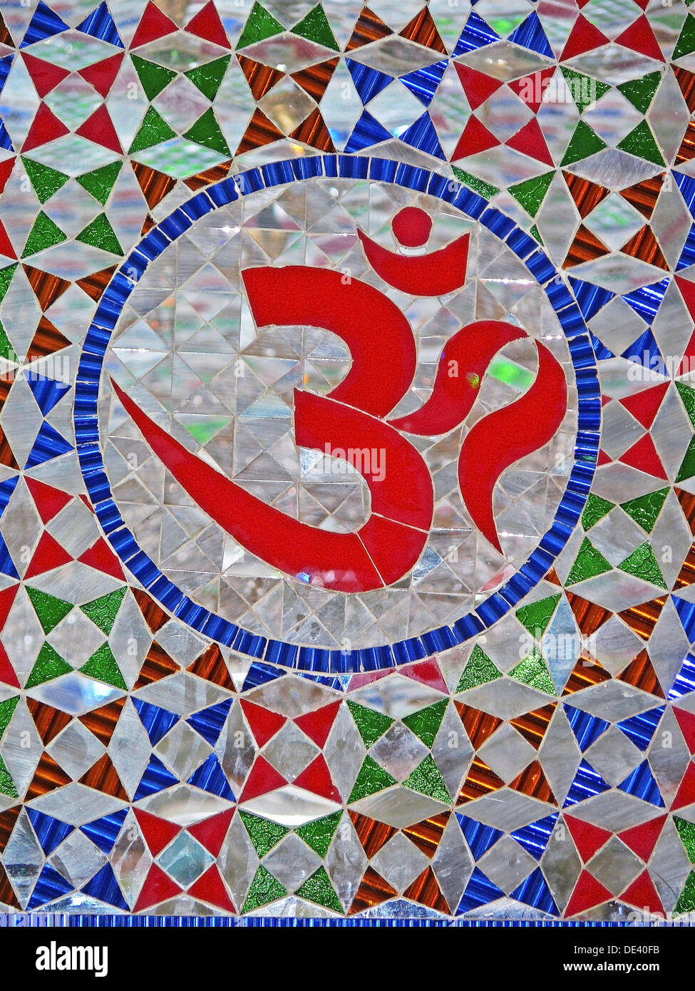 OM symbol of Hinduism, A holy sign called om, cutout in glass in lord Viththal madir,temple, Viththalwadi, withthalwadi, Pune, Stock Photo