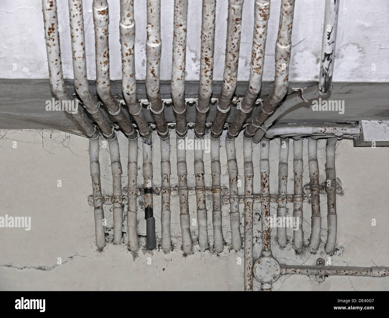 Electrical conduits or pipes, galvanised pipes on a brick wall Pune