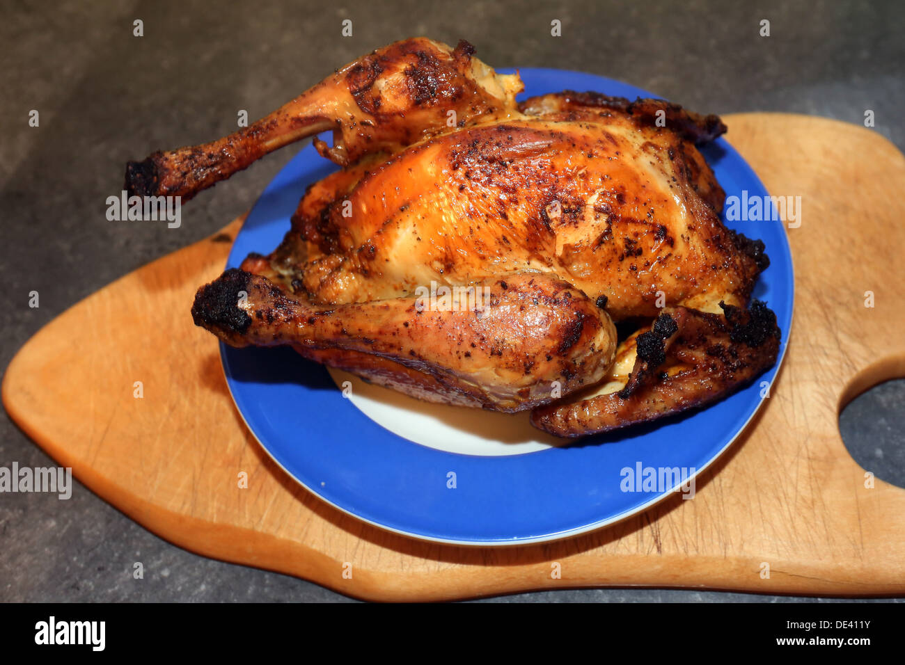 Berlin, Germany, roasted chicken on a plate Stock Photo