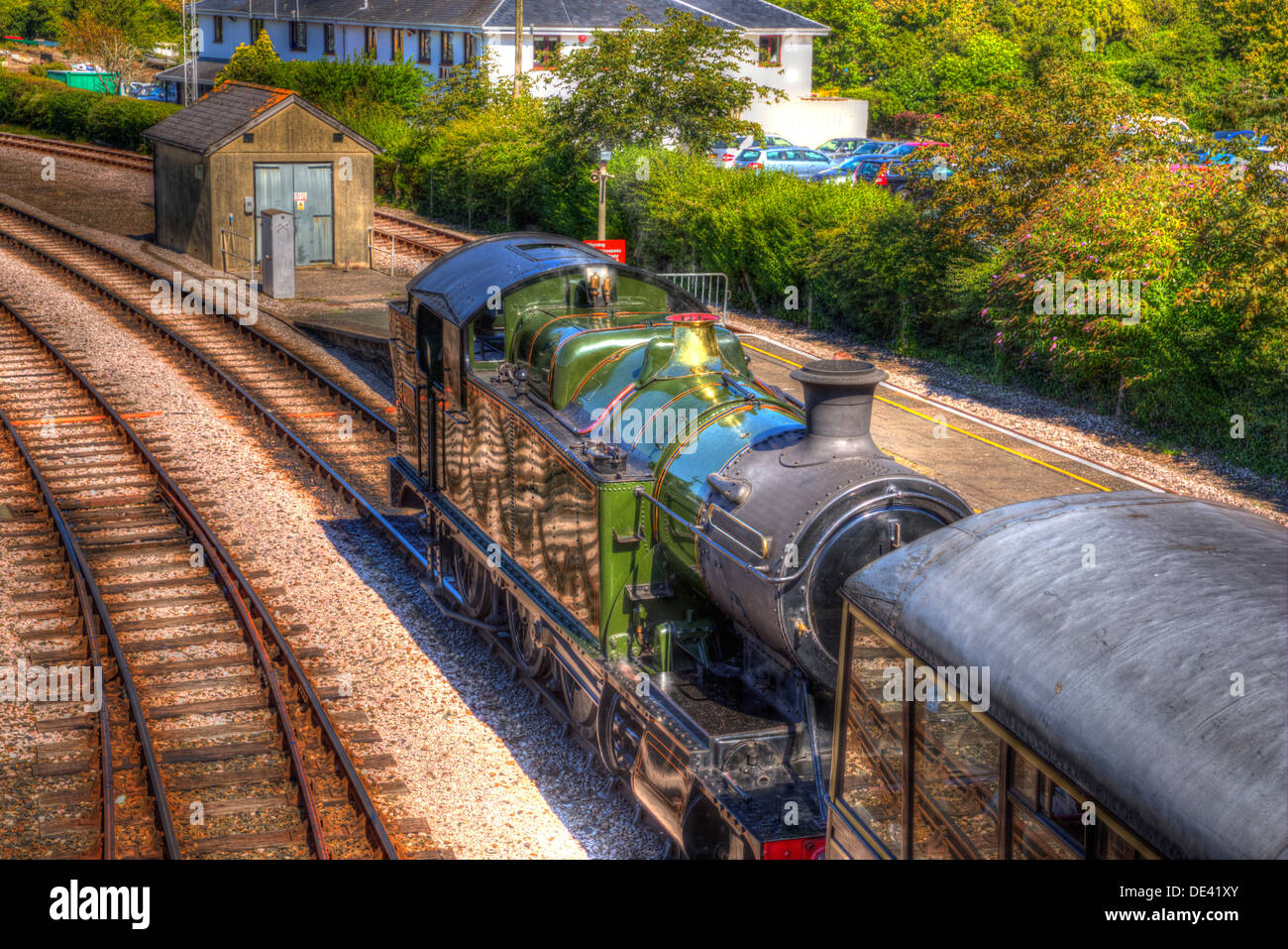 Steam Train engine in station with railway tracks in HDR like painting Stock Photo