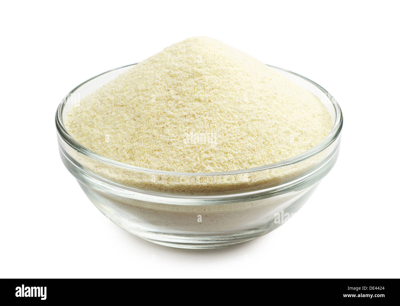 Semolina in a glass bowl on a white background Stock Photo
