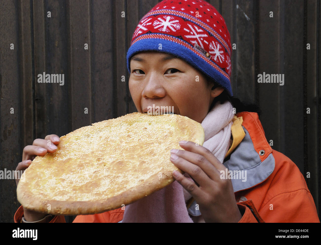 Chinese girl eating Chinese bread Stock Photo Alamy