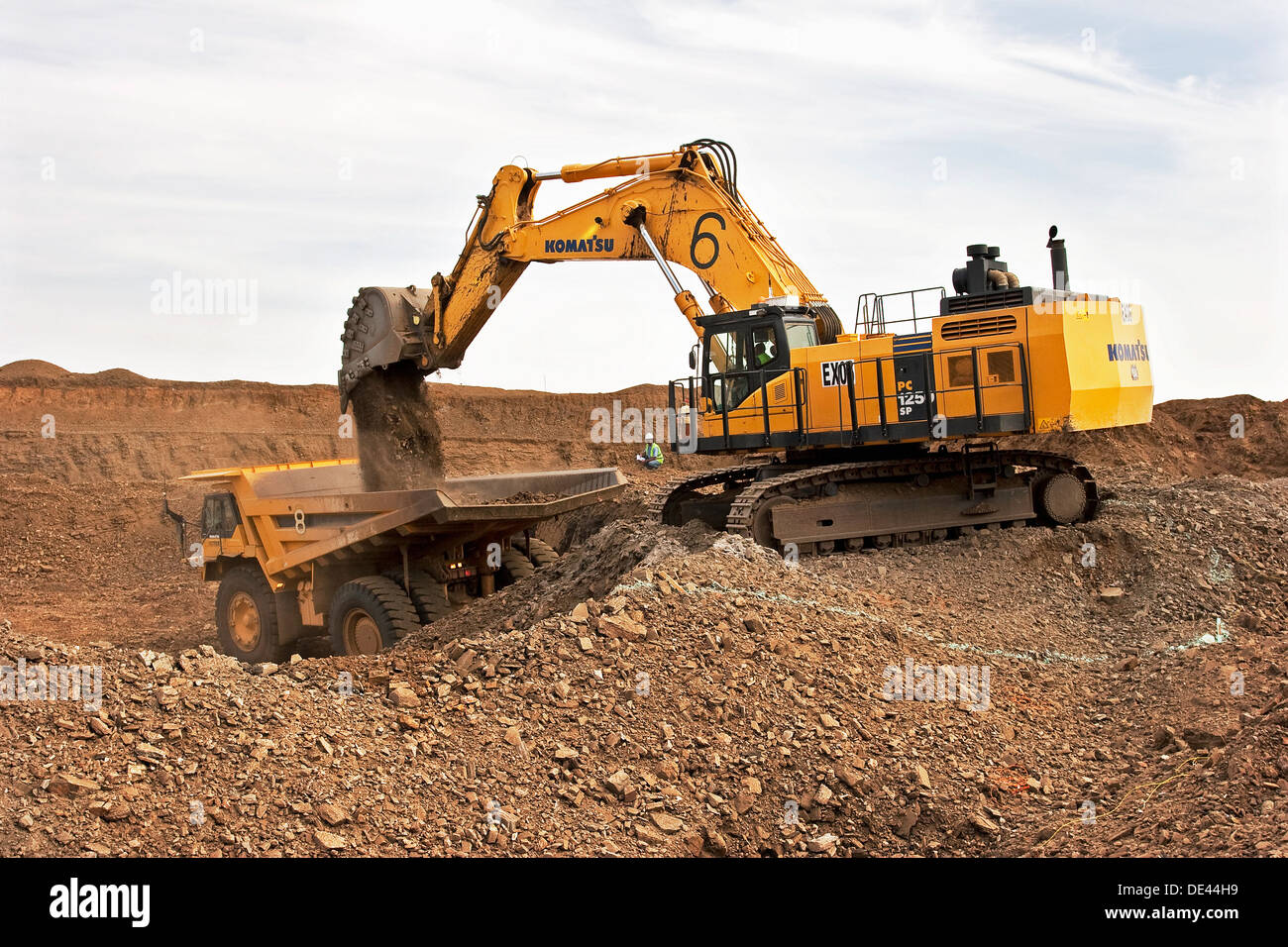 Gold mining in open cast surface pit with excavator and haul truck working, Mauritania, NW Africa Stock Photo