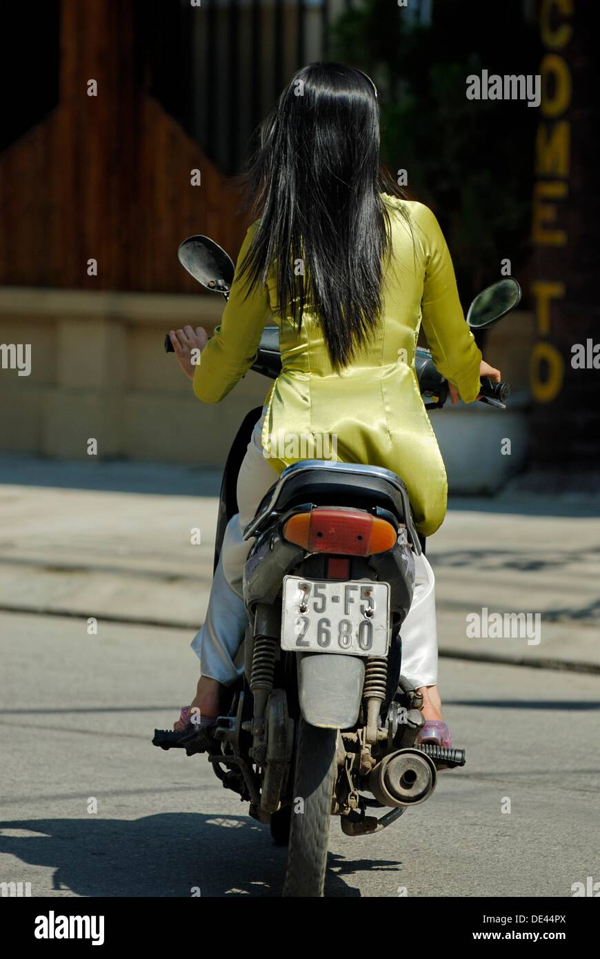 girl riding motorcycle in skirt