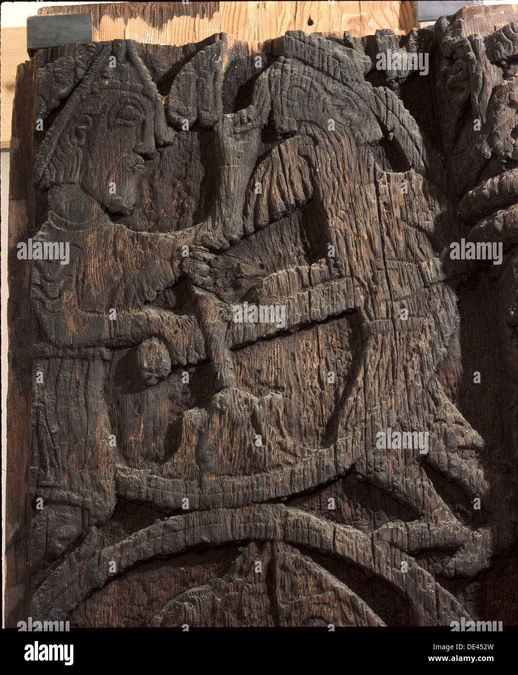 Detail of a carving from a stave church portal illustrating the story