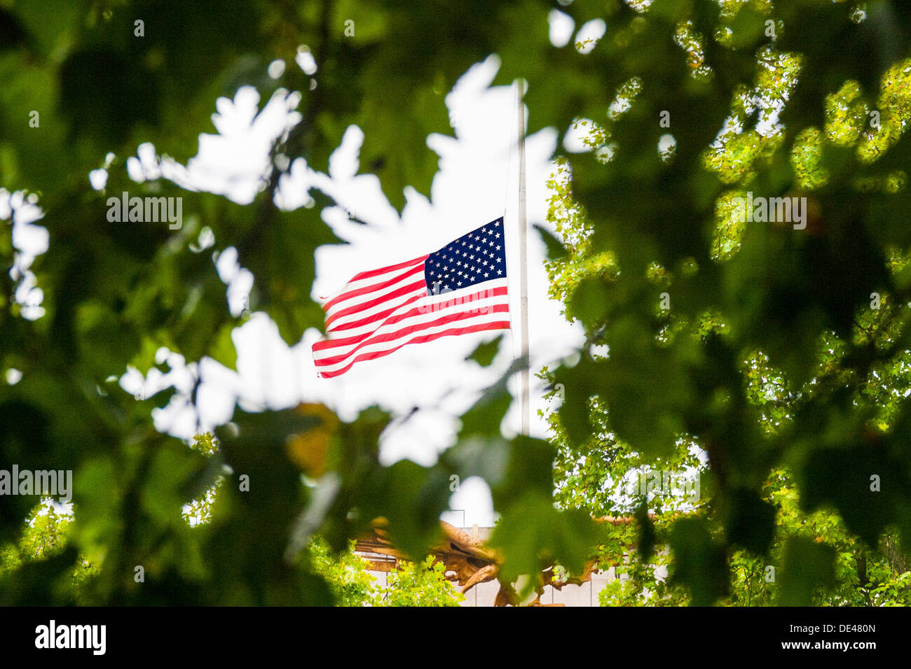 Grosvenor Square, London, UK. 11th Sep, 2013. The United States flag flies at hal mast at the US Embassy in London on the anniversary of the 9-11 terrorist attacks on America. Credit:  Paul Davey/Alamy Live News Stock Photo