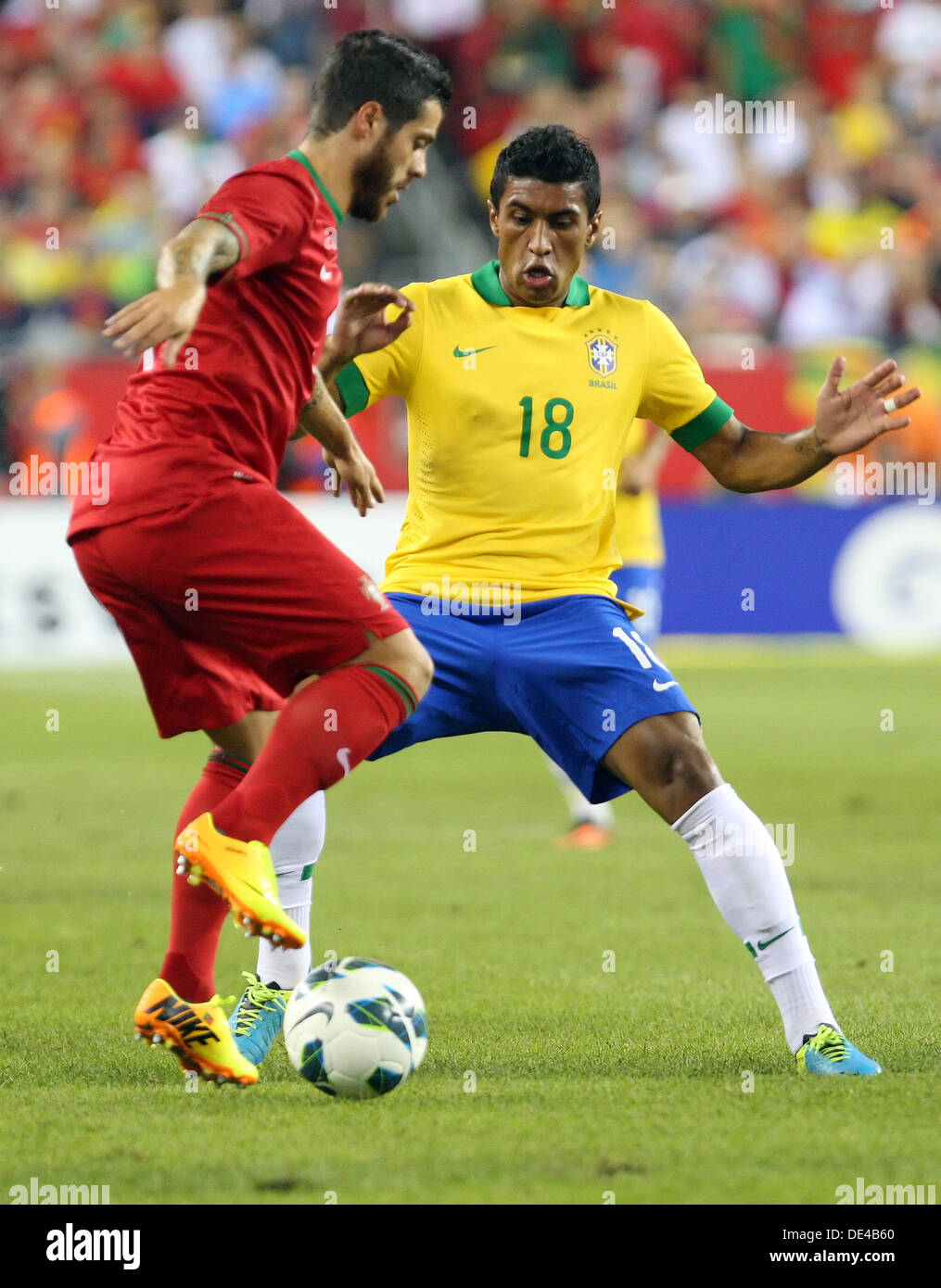 Foxborough, Massachusetts, USA. 11th Sep, 2013. September 10, 2013: Portugal forward Vieirinha (11) and Brazil midfielder Paulinho (18) in action during the international friendly soccer match between Brazil and Portugal at Gillette Stadium in Foxborough, Massachusetts. Brazil defeated Portugal 3-1. Anthony Nesmith/CSM/Alamy Live News Stock Photo