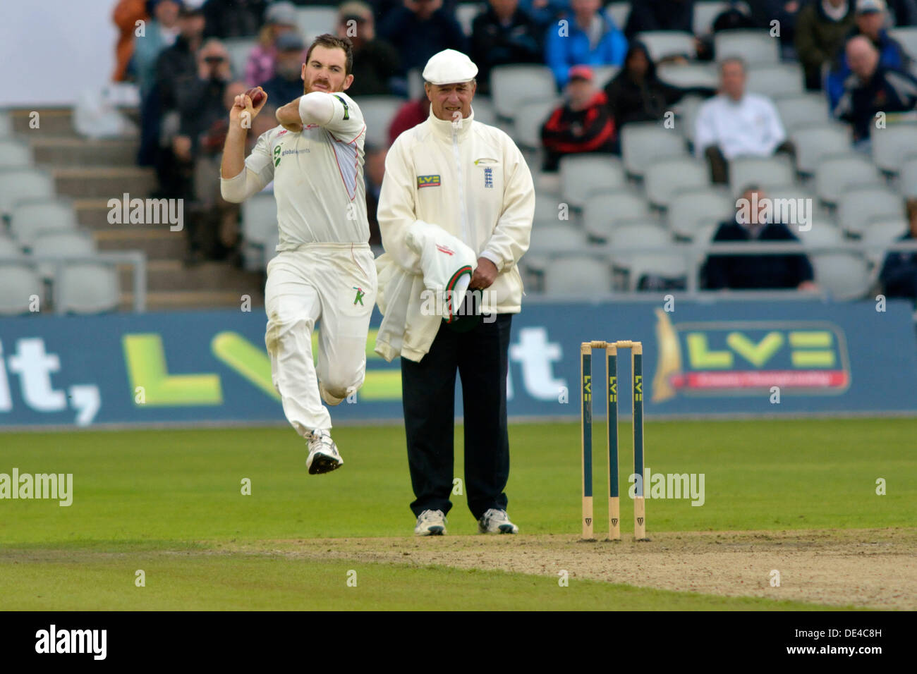 Old Trafford, Manchester, UK. 11th Sep, 2013. Ben Raine (Leicestershire) bowls during the first morning of the rain-affected Championship match against Lancashire. Lancashire v Leicestershire, Emirates Old Trafford, Manchester, UK  11 September 2013 Credit:  John Fryer/Alamy Live News Stock Photo