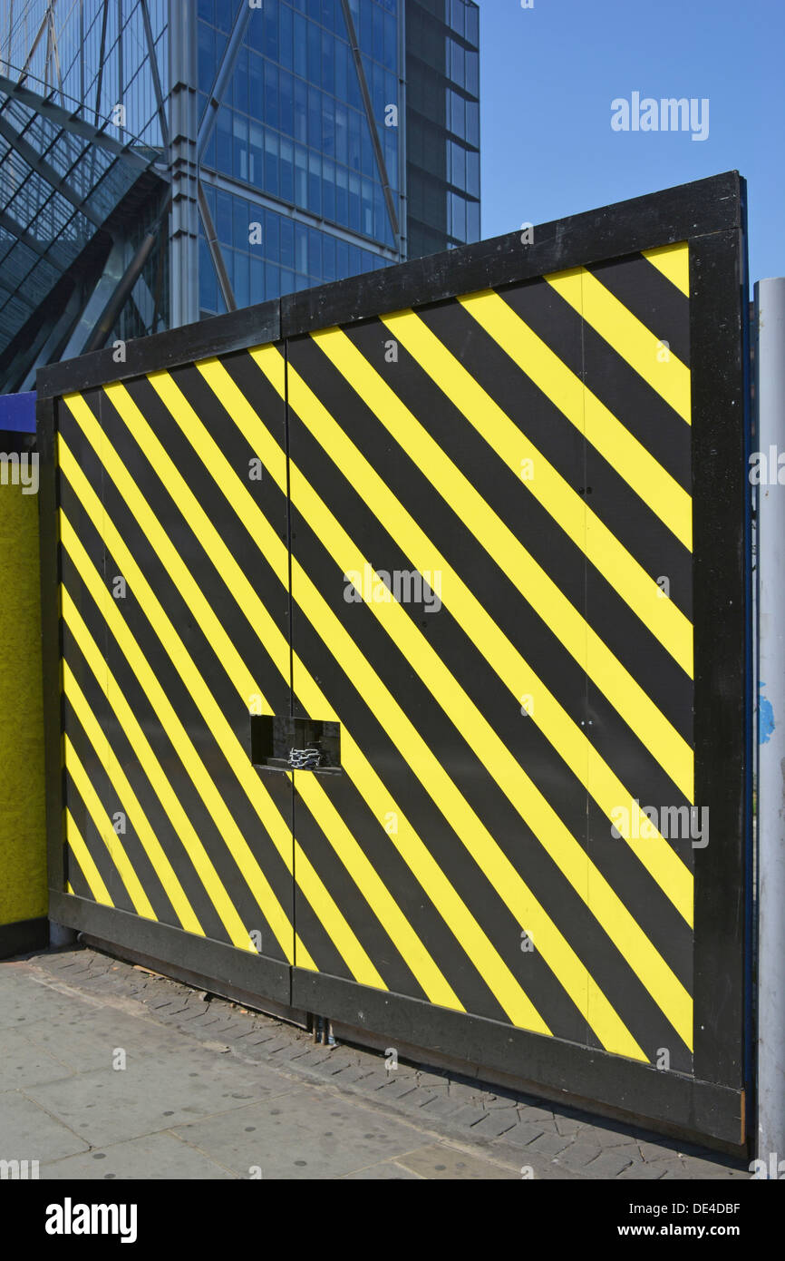 Pair of padlocked access gates to construction site Stock Photo