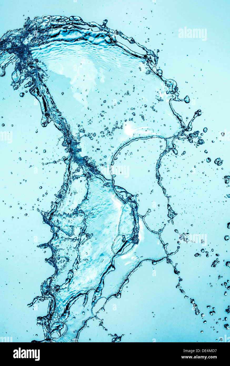 Abstract water splash on blue background. Stock Photo