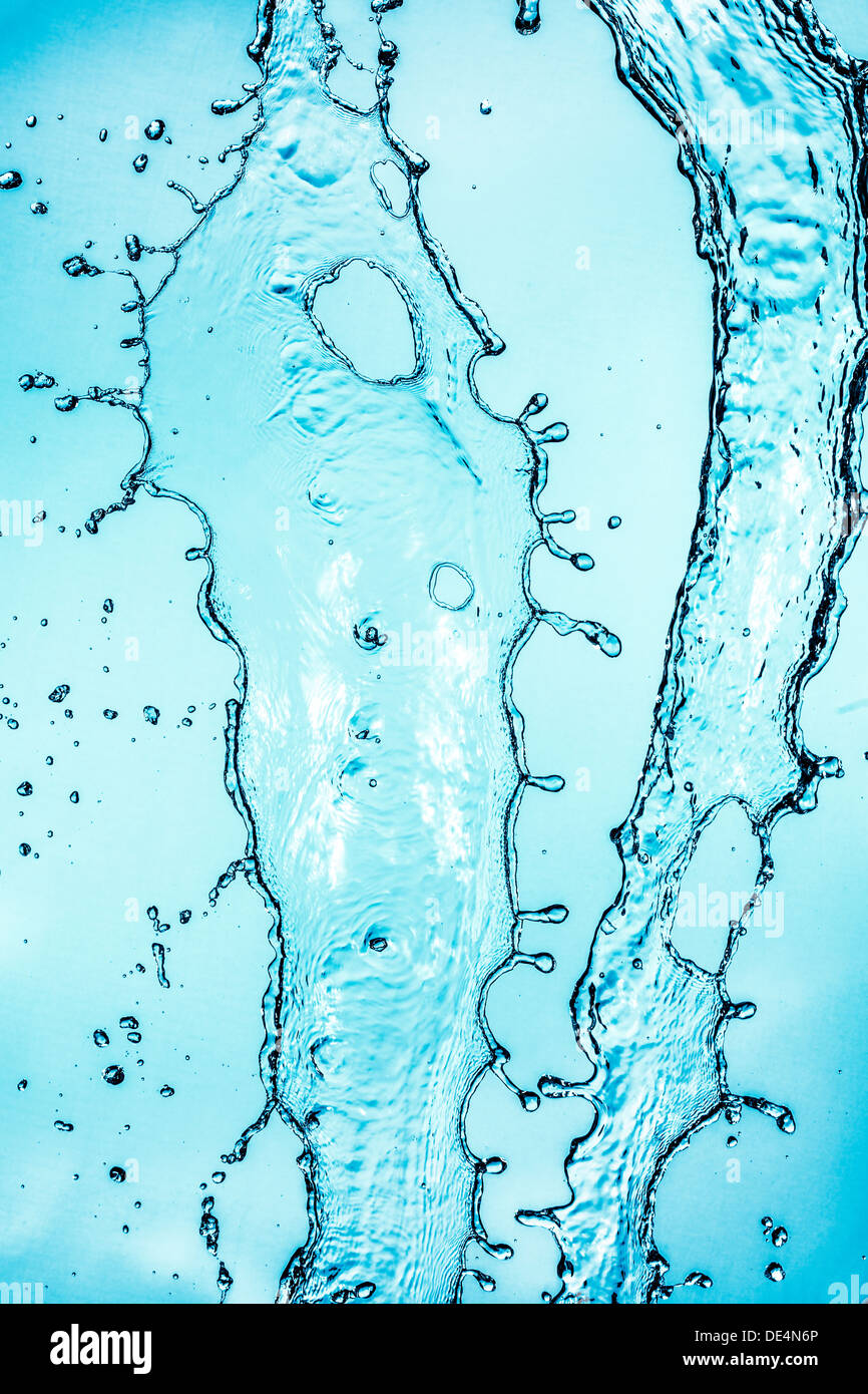 Abstract water splash on blue background. Stock Photo