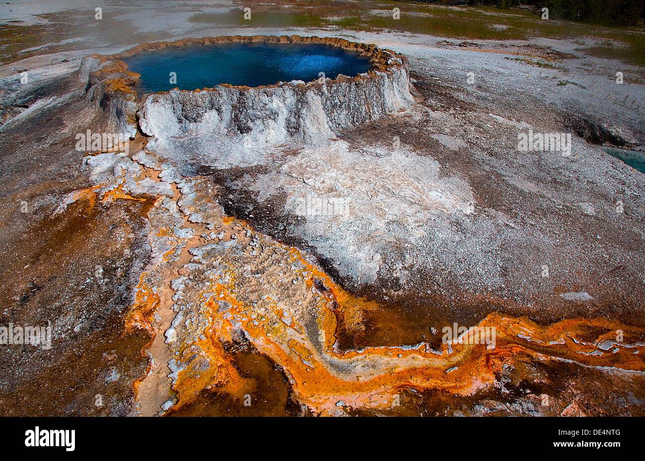 Punchbowl spring produces vivid colors from bacteria in the Upper geyser Basin near Old Faithful at Yellowstone National Park, Stock Photo
