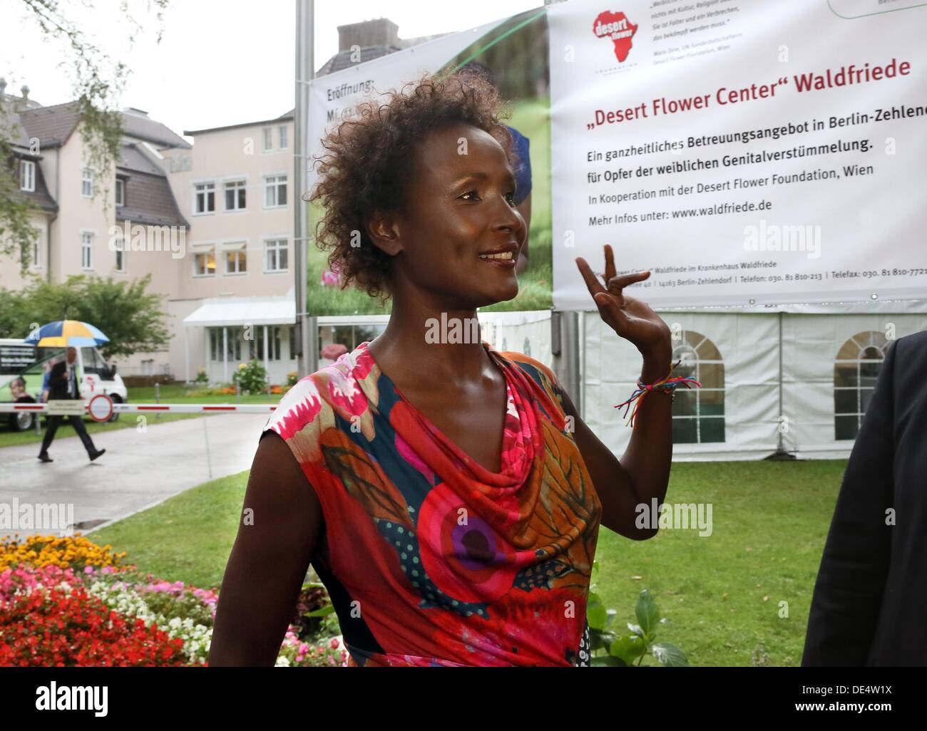 Berlin, Germany. 11th Sep, 2013. Waris Dirie, Somalian author of the bestseller 'Forest Flower' and activist against female genital cutting is greeted at the opening of the 'Desert Flower Centre' of which she is a patron at hospital Waldfriede in Berlin, Germany, 11 September 2013. The centre is the first hospital in Europe that treats women with femal gentical cutting psychologically and surgically. Photo: STEPHANIE PILICK/dpa/Alamy Live News Stock Photo