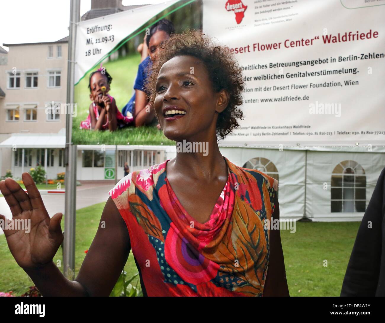Berlin, Germany. 11th Sep, 2013. Waris Dirie, Somalian author of the bestseller 'Forest Flower' and activist against female genital cutting is greeted at the opening of the 'Desert Flower Centre' of which she is a patron at hospital Waldfriede in Berlin, Germany, 11 September 2013. The centre is the first hospital in Europe that treats women with femal gentical cutting psychologically and surgically. Photo: STEPHANIE PILICK/dpa/Alamy Live News Stock Photo