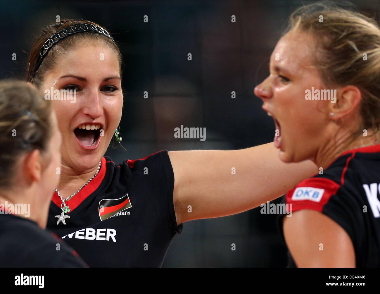 Corina Ssuschke-Voigt (L-R) and Margareta Anna Kozuch of Germany celebrate during their women's CEV Volleyball European Championship quarterfinal match between Germany and Croatia at Gerry Weber Stadium in Halle/Westphalia, Germany, 11 September 2013. Photo: Friso Gentsch/dpa +++(c) dpa - Bildfunk+++ Stock Photo