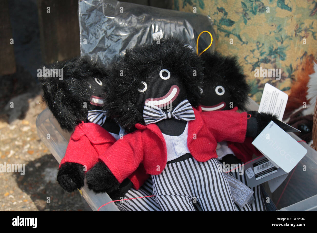 Golly (golliwogg) dolls on sale outside a tourist shop in Burley, New Forrest, Hampshire, UK. Stock Photo