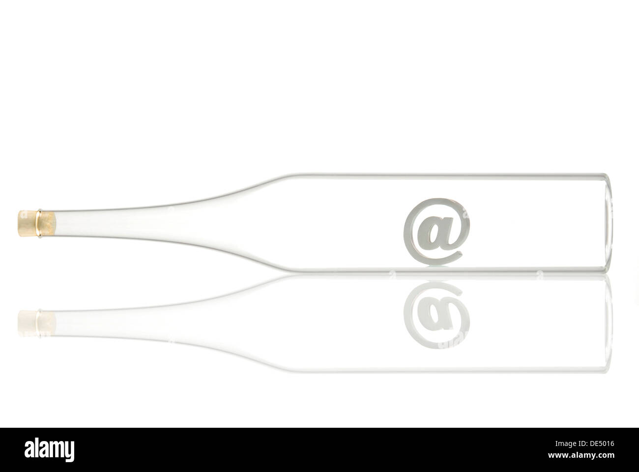 Horizontal glass bottle containing an atsign Stock Photo Alamy