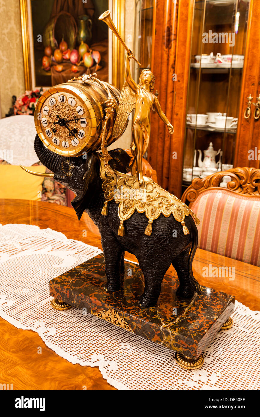 Vintage golden clock on an elephant Stock Photo