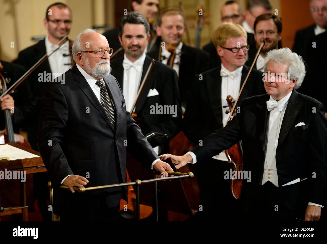 Krzysztof Penderecki (left) thanks to the audience for ovation after performing Agadia from the 3rd symphony which Czech Philharmony played under the leadership of Jiri Belohlavek (right) during the International Music Festival Dvorakova Praha in Prague, Czech Republic on September 10, 2013. (CTK Photo/Michal Kamaryt) Stock Photo