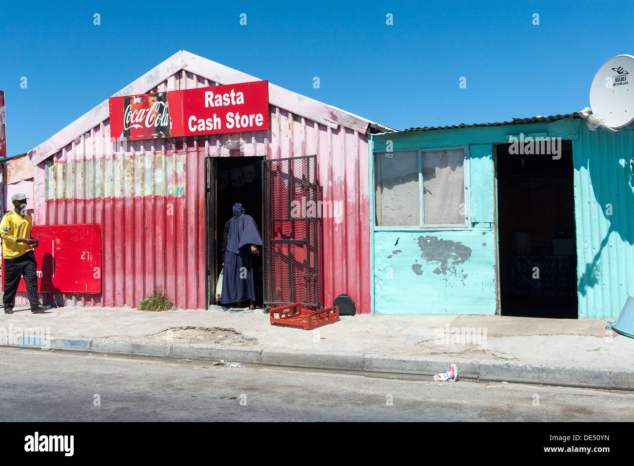 Shop in a tin shack people shopping in Khayelitsha, a partially informal township in Cape Town, South Africa Stock Photo