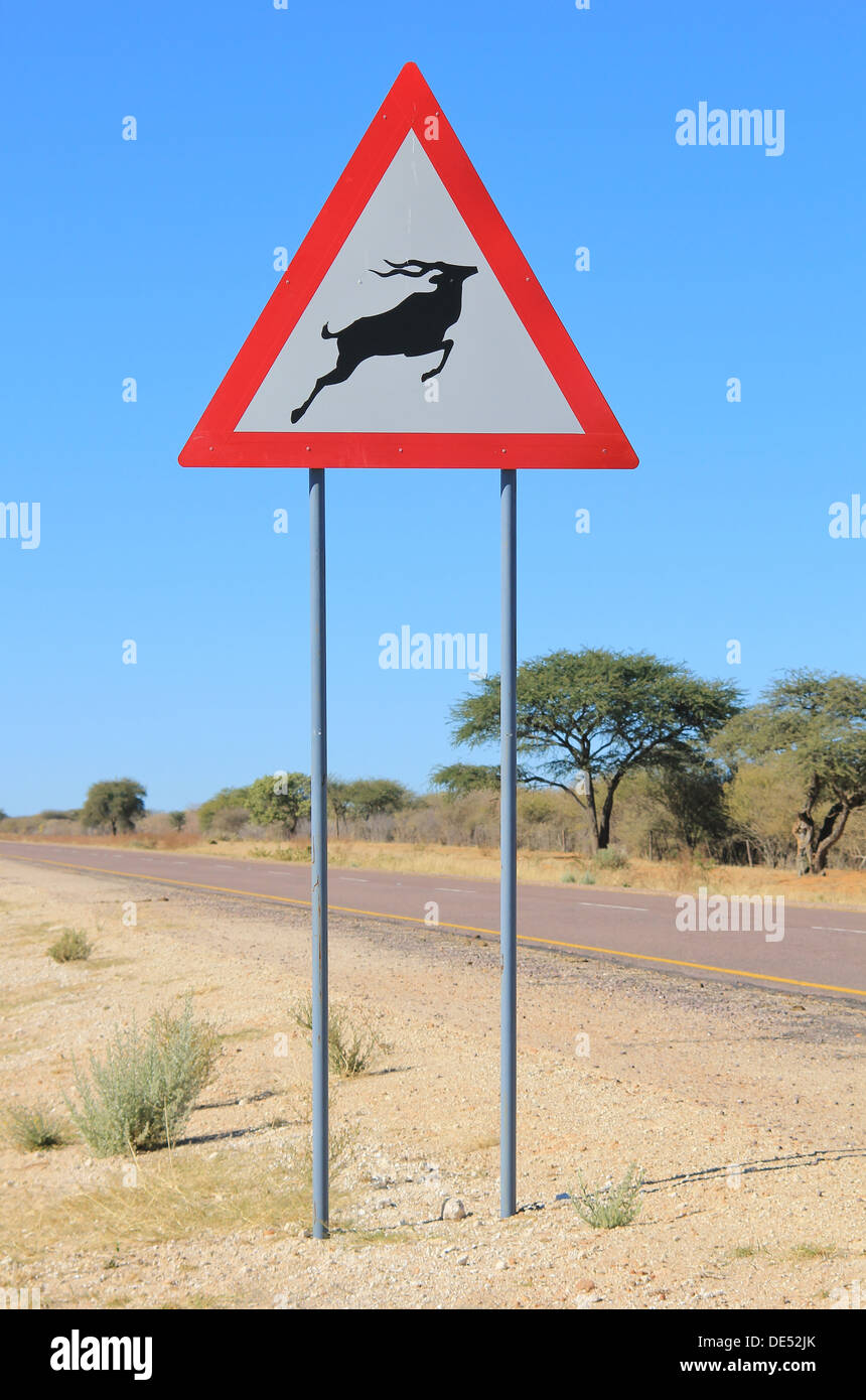 Kudu - A road warning sign to alert drivers and road users of possible and irregular crossings by animals.  Avoid accidents. Stock Photo