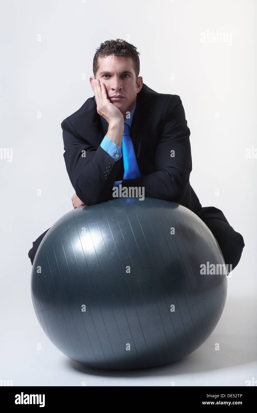 guy-sitting-on-gym-ball-high-resolution-stock-photography-and-images