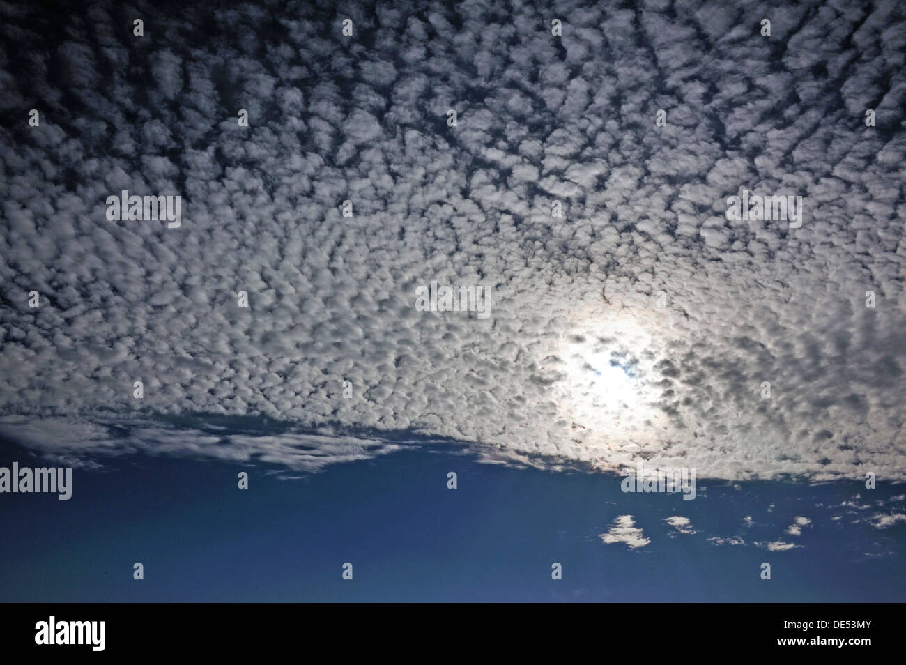 Fluffy clouds or cirrocumulus clouds, with the sun, Bentin, Rögnitz, Mecklenburg-Western Pomerania, Germany Stock Photo