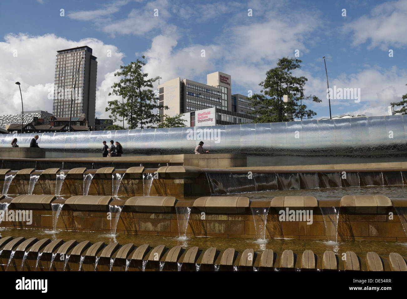 Sheffield Sheaf Square, fountain water feature, station forecourt, Sheffield city centre England UK. Hallam University building Stock Photo