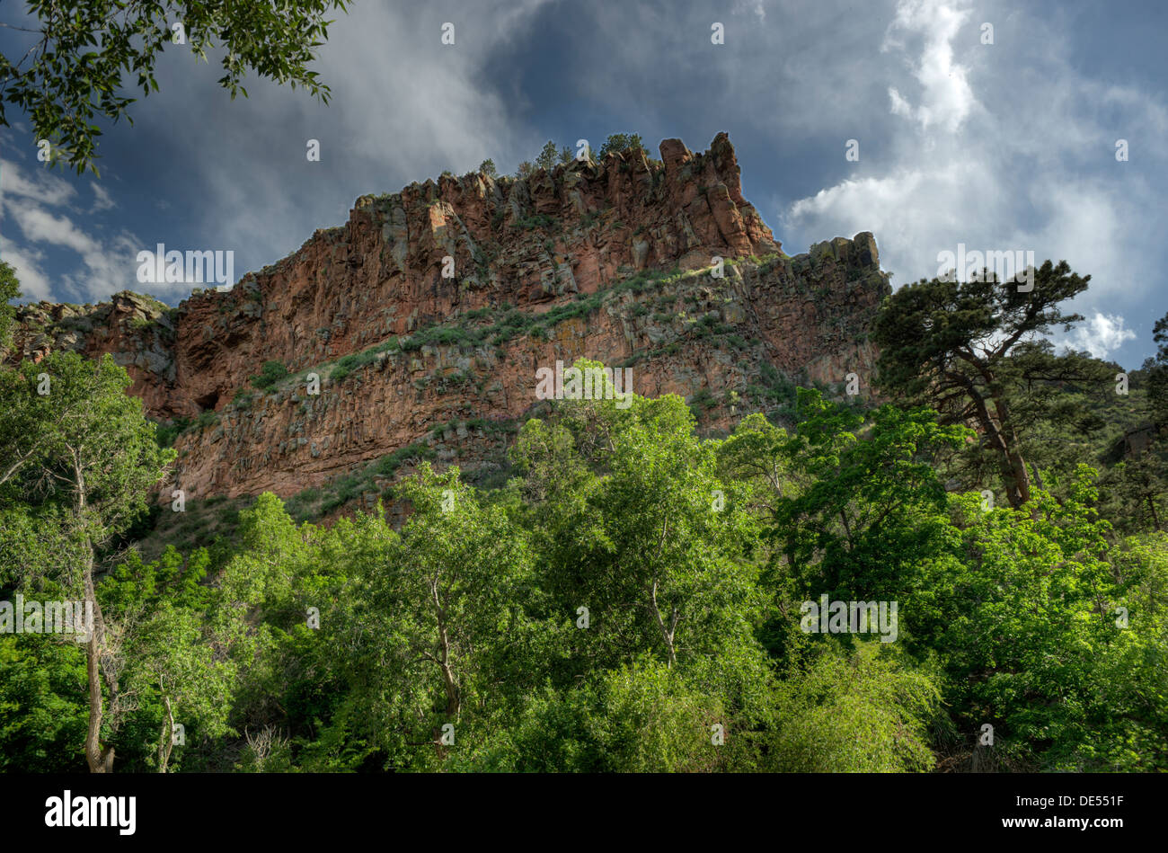 A view of the red cliffs above Meadow Park in Lyons, Colorado Stock