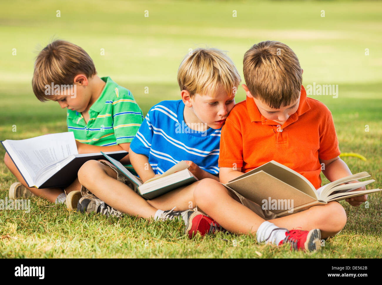 Group of Happy Kids Reading Books Outside, Friendship and Learning